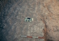 Fieldview of floor made up of upended bricks or fallen wall with visible potstands